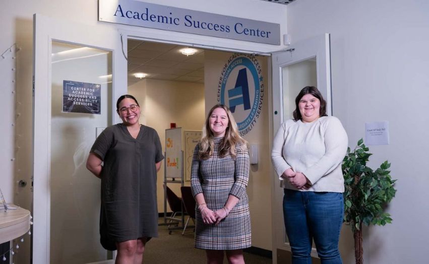 Image of staff members at the doors of the Center for Academic Success in the Buley Library