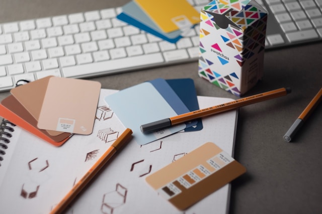 Desk with art supplies, photo by Andy Brown on Unsplash