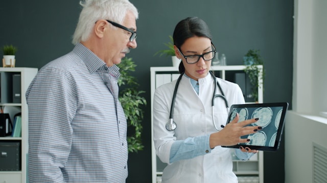 Female doctor showing male patient a scan, photo by Vitaly Gariev on Unsplash